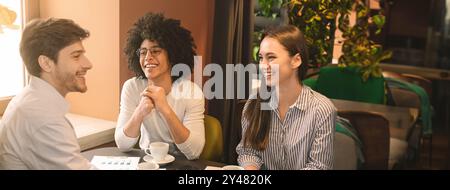 Cheerful business partners discussing strategy of new start up project Stock Photo