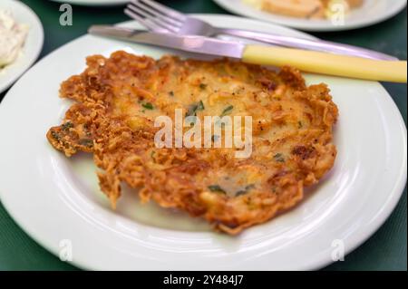 Traditional Andalusian dish from deep roasted potato and seafood, Tortillitas de Camarones, Shrimp Fritters served in old tavern as tapas, Sanlucar de Stock Photo