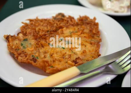 Traditional Andalusian dish from deep roasted potato and seafood, Tortillitas de Camarones, Shrimp Fritters served in old tavern as tapas, Sanlucar de Stock Photo