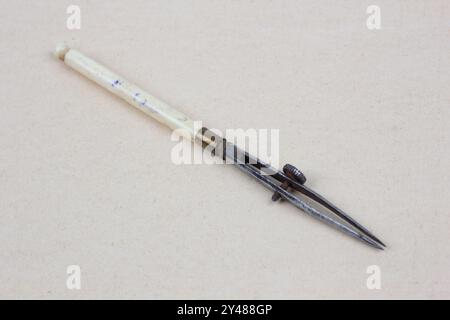 Antique Ruling Pen Vintage retro ruling pen on paper background Stock Photo - Alamy