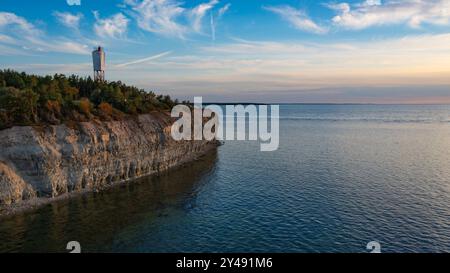 Aerial view over the Baltic sea. The Panga cliff in Saaremaa, Estonia during sunny evening. the highest bedrock outcrop in western Estonia. August 202 Stock Photo