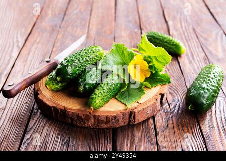 cucumbers on wooden cutting board, fresh organic vegetable food Stock Photo