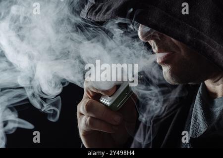 Vaping device, electronic cigarette, nicotine free vape isolated on the  white background. Vapor box mod tank with vaping liquid. Smoke addiction  quit Stock Photo - Alamy