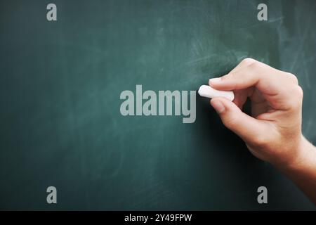 Student, hands and writing on chalkboard in classroom with problem solving, education and learning development. Scholarship, person and answer Stock Photo