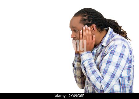 Closeup side view profile portrait of a sad bothered stressed serious young man chin on hands really depressed about something, isolated white Stock Photo