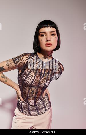 A young woman with a unique tattoo design and short hair models a