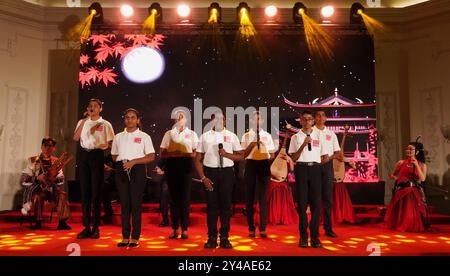 (240917) -- COLOMBO, Sept. 17, 2024 (Xinhua) -- Sri Lankan students perform at the Mid-Autumn Poetry Gathering in Colombo, Sri Lanka, Sept. 16, 2024. From beautiful lantern decorations to mooncake-making workshops and poetry and song performances, Mid-Autumn Festival celebrations are being held around the world, bringing together people from diverse backgrounds to appreciate traditional Chinese culture. The festival, celebrated annually on the 15th day of the eighth month in the Chinese lunar calendar, falls on Sept. 17 this year. As one of China's most important traditional holidays, it is Stock Photo