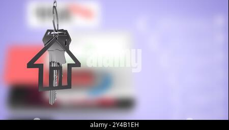 House-shaped keychain image over blurred background with colorful shapes Stock Photo