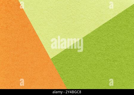 Texture of craft orange, green and olive shade color paper background, macro. Structure of vintage abstract cardboard with geometric shape and gradien Stock Photo