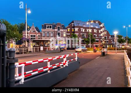 View from the Wirdumerpoortsbrug to the beautiful facades in the Zuiderplein at dusk, Leeuwarden, Netherlands Stock Photo