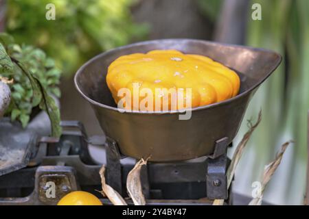 Yellow squash pumpkin in nostalgic market scales Stock Photo