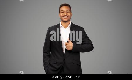 Afro guy showing thumb up and smiling Stock Photo