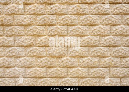 Background of an old beige brick wall Stock Photo
