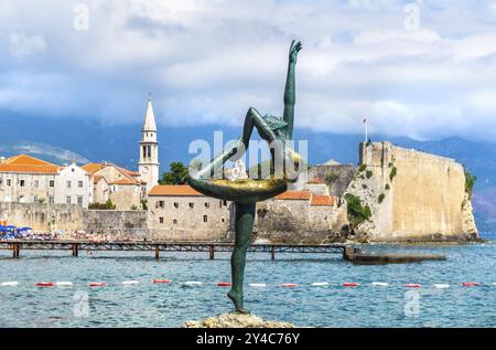 Statue of ballerina on a background of Old Town in Budva, Montenegro, Europe Stock Photo