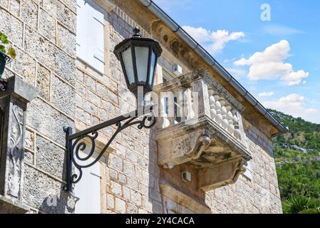Retro lantern near balcony on old house in Perast, Montenegro, Europe Stock Photo