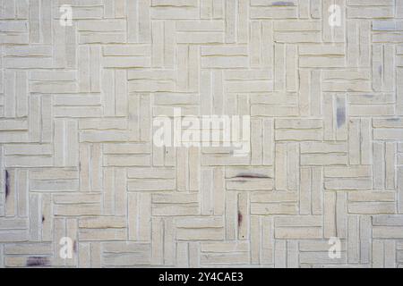 Background made from a wall of small beige bricks Stock Photo