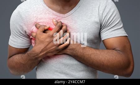 Cropped of young black man having heart attack Stock Photo