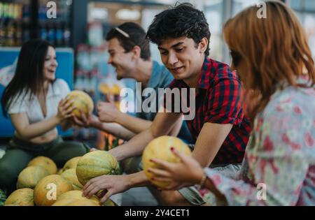 Friends enjoying fresh fruits at a local market together Stock Photo ...
