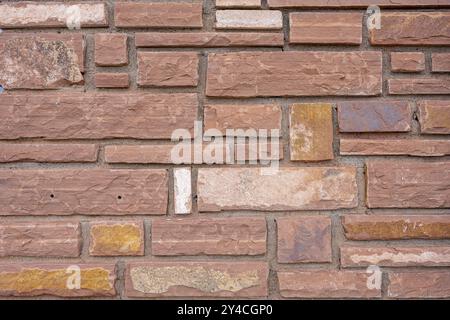 Background of a wall made of red sandstone bricks Stock Photo