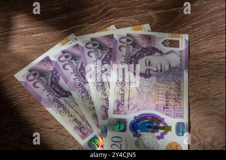 Currency banknotes spread across frame british pound sterling in various denomination Stock Photo