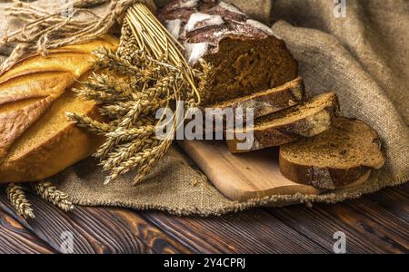 Still life with fresh bread on wooden table Stock Photo