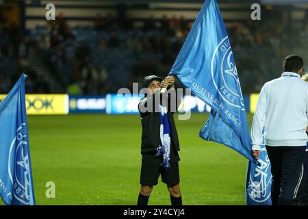 17th September 2024; Loftus Road Stadium, Shepherds Bush, West London, England; Carabao Cup Third Round Football, Queens Park Rangers versus Crystal Palace; A young flag waver practising before the players come out. Stock Photo