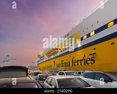 Vado Ligure, Savona, Italy - August 31, 2024: Corsica Sardinia Ferries ferry docked at the quay with cars waiting to be boarded at first light Stock Photo