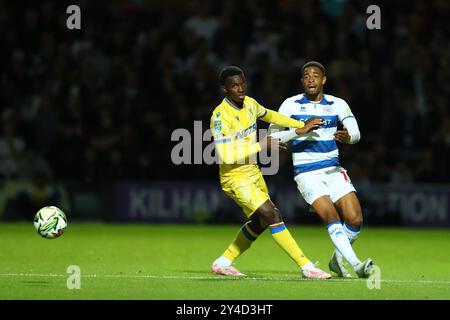 17th September 2024; Loftus Road Stadium, Shepherds Bush, West London, England; Carabao Cup Third Round Football, Queens Park Rangers versus Crystal Palace; Elijah Dixon Bonner of Queens Park Rangers passes the ball before the arriving Eddie Nketiah of Crystal Palace. Stock Photo