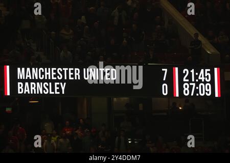 Scoreboard show 7-0 scoreline during the Carabao Cup 3rd Round match Manchester United vs Barnsley at Old Trafford, Manchester, United Kingdom, 17th September 2024  (Photo by Mark Cosgrove/News Images) Stock Photo