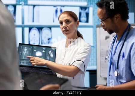 Medical team collaborates on diagnostic procedures and treatment plans. Professionals in radiology and radiography support accurate diagnosis and effective disease prevention, insurance. Stock Photo