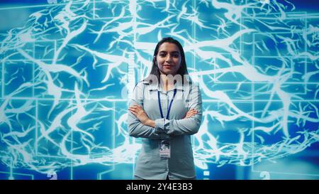 Portrait of smiling technician running artificial intelligence programming scripts. Joyful admin working in IT department tasked with AI applications development, camera B Stock Photo