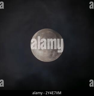 London, UK. 18th Sep, 2024. A 4% partial eclipse of the harvest supermoon in the early hours is visible from the UK with maximum taking place around 3.40am where Earth's shadow can be seen upper right on the lunar disk. Credit: Malcolm Park/Ģ����ý Live News Stock Photo