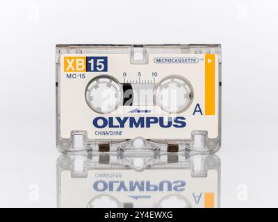 Micro audio cassette for voice recorders Olympus XB15 MC-15 Microcassette standing full face isolated on a white background Stock Photo