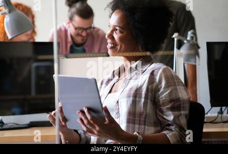 African american woman with tablet, innovation in research and programming for future app technology Stock Photo