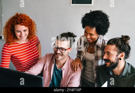 Group of business people and software developers working as a team in office Stock Photo