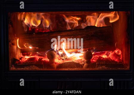 Open fire, blazing fire, fire and flames in a fireplace insert Stock Photo