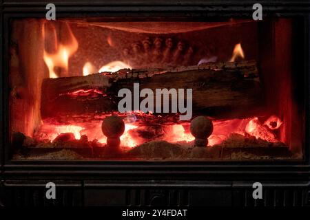 Open fire, blazing fire, fire and flames in a fireplace insert Stock Photo