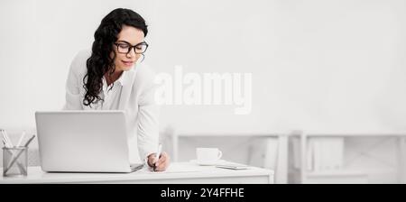 Mexican woman taking down some notes and ideas Stock Photo