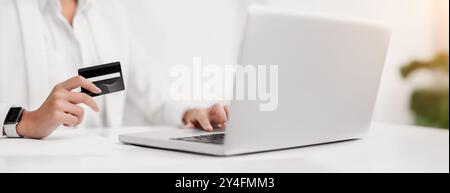 Closeup of girl making purchases using laptop computer Stock Photo