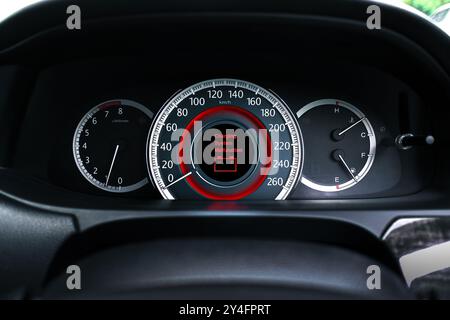 A battery charging system malfunction is displayed on the vehicle dashboard screen , Car repair concept Stock Photo