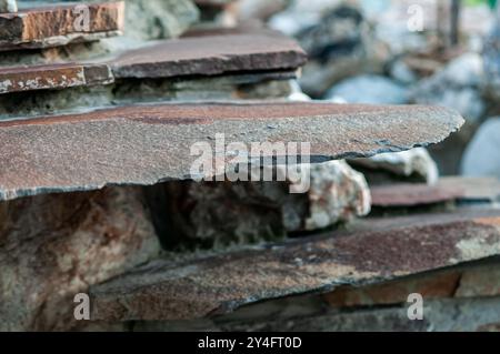 Close-Up of Layered Natural Stone Slabs in Outdoor Setting. Stock Photo