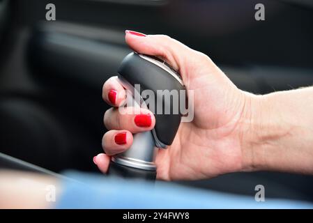 Woman shift gears in car Stock Photo