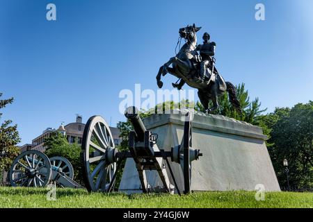 Andrew Jackson Statue Lafayette Park Washington DC | WASHINGTON DC — The first equestrian statue cast in the United States stands at the center of Lafayette Park, depicting Andrew Jackson raising his hat as his horse rears beneath him — a scene evoking his command at the Battle of New Orleans. Created by self-taught sculptor Clark Mills and dedicated on January 8, 1853, the approximately 15-ton bronze was cast in ten pieces and solved a problem that had defeated earlier sculptors: balancing the entire weight of horse and rider solely on the horse's two hind legs. The white marble pedestal bear Stock Photo