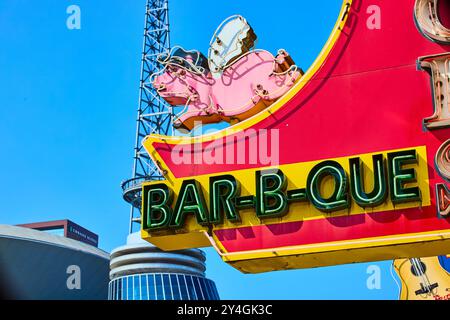 Neon BBQ Sign with Pink Pig in Nashville Streetscape Eye-Level View Stock Photo