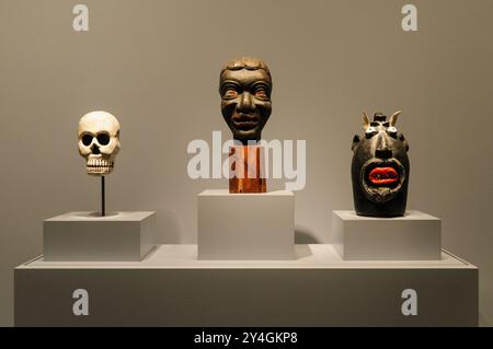 WASHINGTON, DC, United States — Three stylized heads are part of the folk art exhibit at the Donald W. Reynolds Center for American Art and Portraiture in downtown Washington, DC. The exhibit showcases works by self-taught artists that reflect the rich cultural heritage of American folk art. Stock Photo