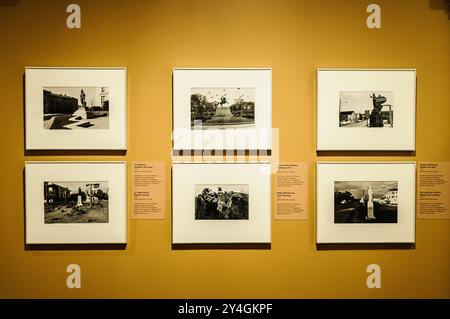 WASHINGTON DC — Visitors explore a photography exhibition at the Donald W. Reynolds Center for American Art and Portraiture in downtown Washington, DC. The center, which houses the Smithsonian's National Portrait Gallery and American Art Museum, features rotating exhibitions showcasing works by American photographers. This historic building, originally constructed as the U.S. Patent Office in the 19th century, serves as an important cultural venue in the nation's capital, presenting various aspects of American portraiture, photography, and visual arts through its diverse collection and special Stock Photo