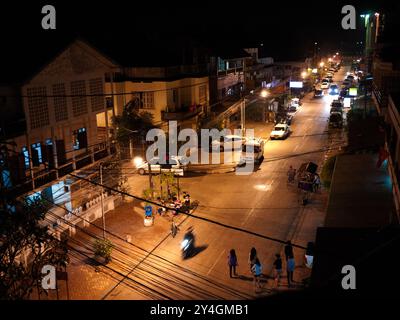 VIENTIANE, Laos — Nighttime aerial view of downtown Vientiane captures the urban landscape of Laos' capital city. The illuminated streets showcase the blend of traditional Laotian architecture with modern urban development, offering a unique perspective of this rapidly evolving Southeast Asian capital. Stock Photo