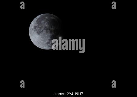 September 18, 2024: Lugo, Galicia, Spain. Supermoon eclipse during the early morning, seen from the northern hemisphere, in the sky of Lugo. (Credit Image: © Cristian Leyva/ZUMA Press Wire) EDITORIAL USAGE ONLY! Not for Commercial USAGE! Stock Photo