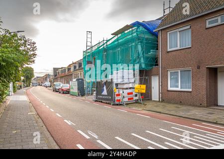 Koudekerk aan den Rijn, Netherlands - October 1, 2021: A house is covered in scaffolding during a renovation Stock Photo