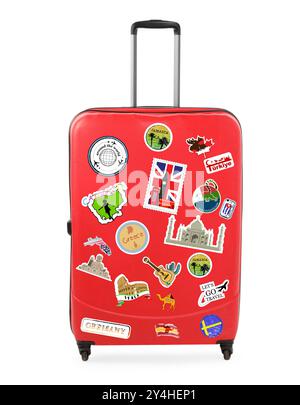 Stylish red suitcase with travel stickers isolated on white Stock Photo